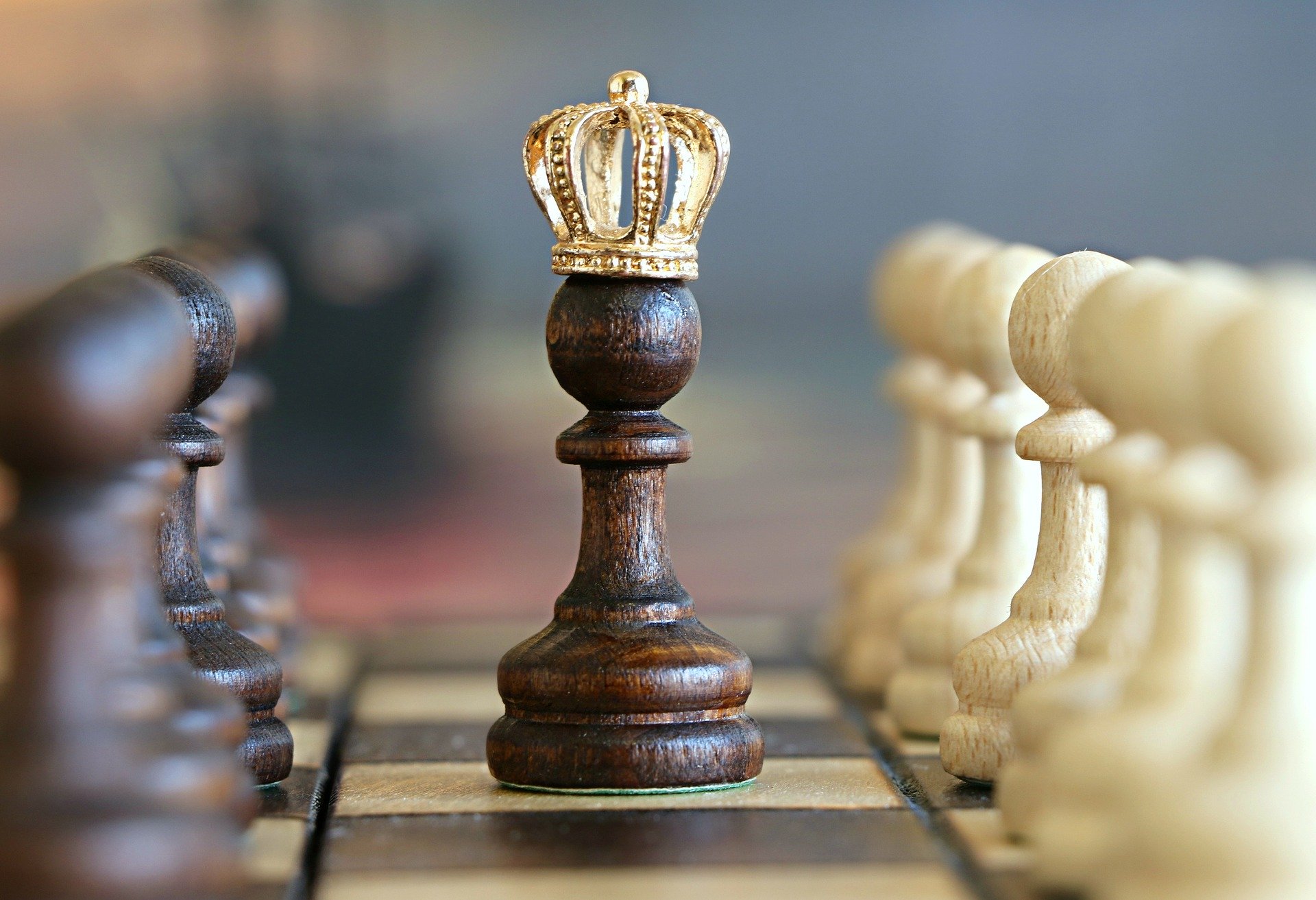 Image of a chess piece with a crown on its head